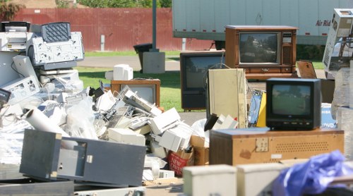 Personnel separating recyclables during waste clearance